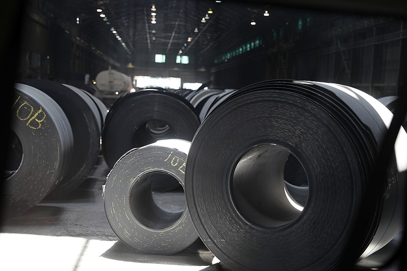 FILE - In this June 28, 2018, file photo, rolls of finished steel are seen at the U.S. Steel Granite City Works facility in Granite City, Ill.  Companies seeking relief from President Donald Trump’s taxes on imported steel and aluminum ran into long delays and cumbersome paperwork, a federal watchdog found, Wednesday, Sept. 16, 2020. The U.S. Government Accountability Office reported that the Commerce Department, overwhelmed by companies lobbying to avoid the tariffs, could not meet its own deadline for processing around three-fourths of the requests. (AP Photo/Jeff Roberson, File)