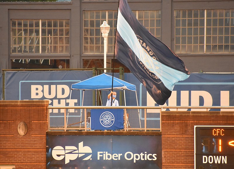 Staff photo by Patrick MacCoon / A Chattanooga Football Club flag is flown in the end zone during Wednesday's NISA Eastern Conference match against New Amsterdam FC at Finley Stadium. CFC won 3-0 to clinch a No. 1 seed for the fall postseason tournament.