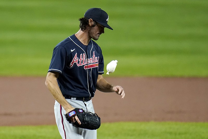 AP photo by Julio Cortez / Atlanta Braves starter Cole Hamels tosses the rosin bag before pitching to the host Baltimore Orioles on Wednesday night.