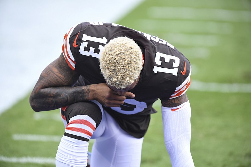 Photo by Terrance Williams of The Associated Press / Cleveland Browns wide receiver Odell Beckham Jr. (13) kneels before the playing of the national anthem before an NFL football game against the Baltimore Ravens on Sunday, Sept. 13, 2020, in Baltimore, Maryland.