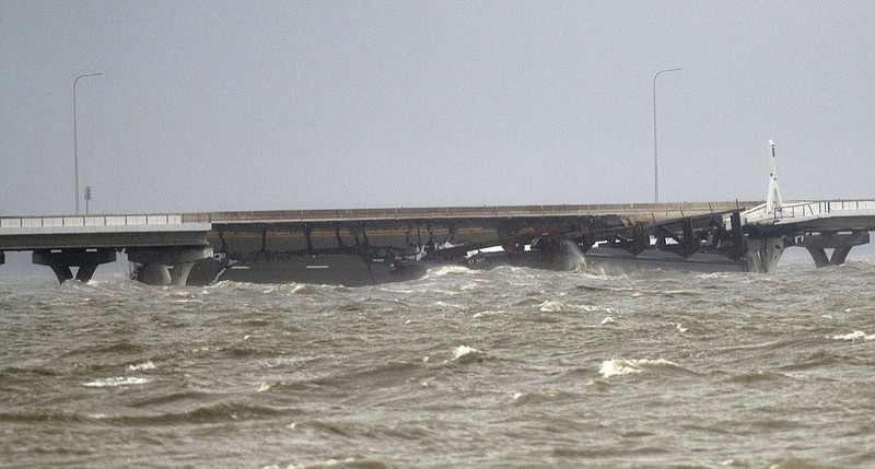 Waves batter the Pensacola Bay Bridge Wednesday, Sept. 16, 2020, in Pensacola, Fla. A portion of the bridge collapsed after a barge came loose and slammed the bridge during Hurricane Sally. (Tony Giberson/Pensacola News Journal via AP)