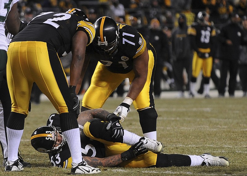 New York Times File Photo / Pittsburgh Steelers center Maurkice Pouncey (53), shown on the ground with an injury during the AFC championship game in 2011, decided he couldn't wear the name of a dead Black teenager on the back of his helmet after he learned the truth about the boy's case.