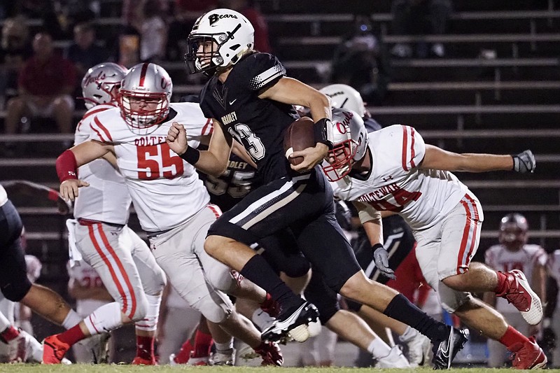 Staff photo by C.B. Schmelter / Bradley Central quarterback Aiden McCleary runs with the ball during Friday's home game against Ooltewah. McCleary took over the position after an injury early this season to starter Javin Burke, and he led the Bears to a rout of the Owls in a Region 2-6A matchup Friday.