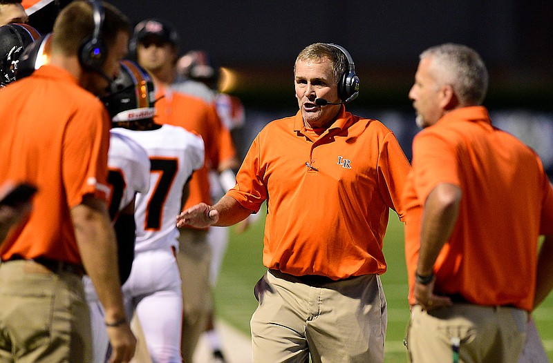 Staff photo by Robin Rudd /  LaFayette football coach Paul Ellis congratulates his offense after the Ramblers scored a touchdown at Gordon Lee on Sept. 18, 2020.