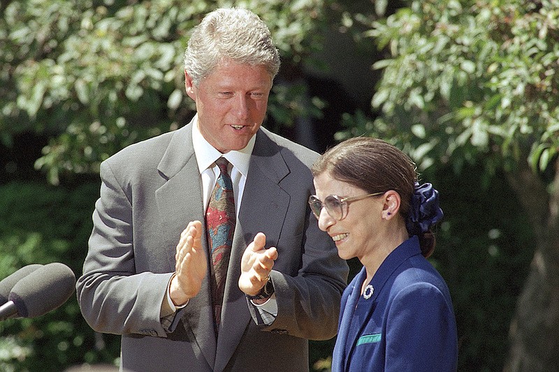 In this June 15, 1993, file photo, President Bill Clinton applauds as Judge Ruth Bader Ginsburg prepares to speak in the Rose Garden of the White House, after the president announced he would nominate Ginsburg to the Supreme Court. Ginsburg, 60, a federal appeals judge, will fill the vacancy left by the retirement of Justice Byron White. Ginsburg, a diminutive yet towering women's rights champion who became the court's second female justice, has died at her home in Washington. (AP Photo/Doug Mills, File)