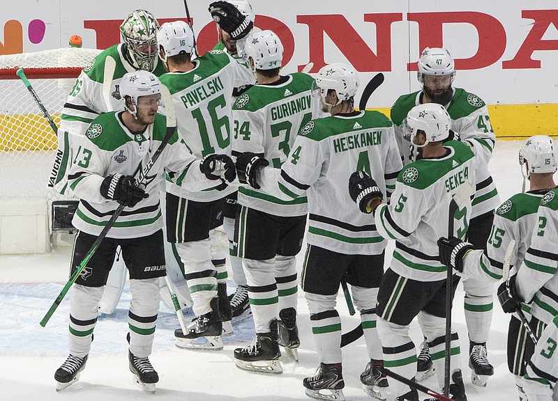 AP photo by Jason Franson / The Dallas Stars celebrate their victory over the Tampa Bay Lightning in Game 1 of the Stanley Cup Final on Saturday night in Edmonton. The Stars won 4-1 to open the best-of-seven series, which continues Monday night.