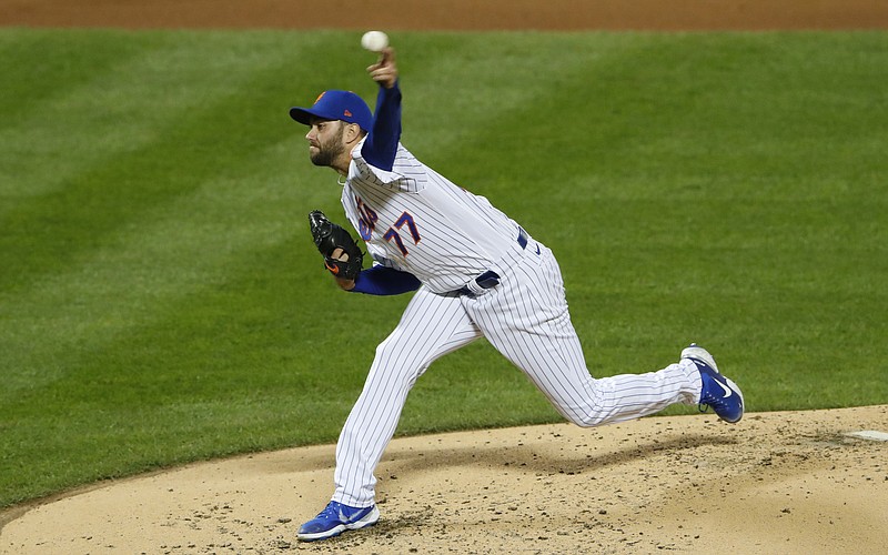 AP photo by Noah K. Murray / New York Mets starter David Peterson pitches during the third inning of Saturday night's home game against the Atlanta Braves.