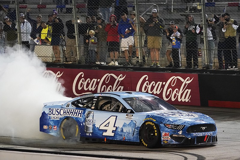 AP photo by Steve Helber / NASCAR driver Kevin Harvick does a burnout in the Stewart-Haas Racing No. 4 Ford after winning Saturday night's Cup Series playoff race at Tennessee's Bristol Motor Speedway.