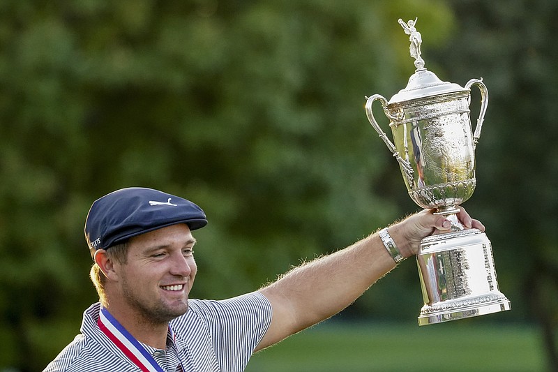 AP photo by John Minchillo / Bryson DeChambeau holds out his trophy after winning the U.S. Open on Sunday at Winged Foot Golf Club in Mamaroneck, N.Y.