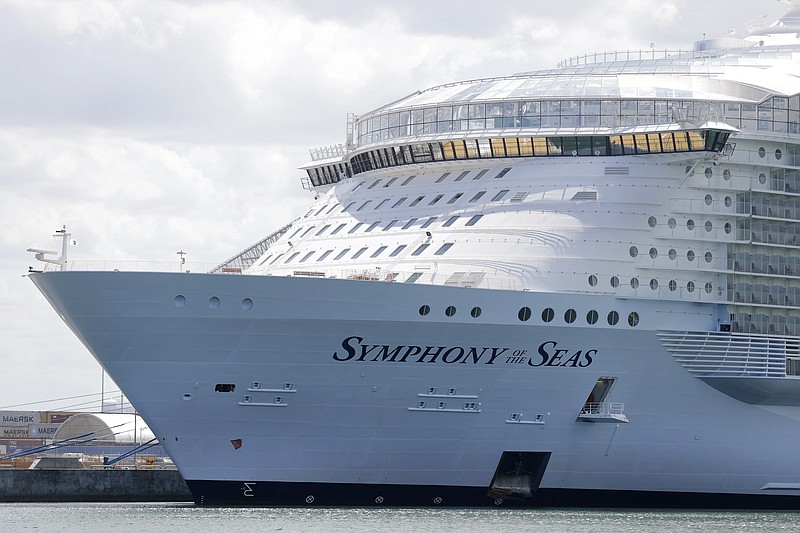 FILE - The Symphony of the Seas cruise ship is shown docked at PortMiami, in a Wednesday, May 20, 2020, file photo, in Miami.Major cruise lines say they will test all passengers and crew for COVID-19 prior to boarding as part of their plan for resuming sailing in the Americas. The Cruise Lines International Association says its members will also require masks onboard and on shore excursions whenever physical distancing can't be maintained. No date has been set for the resumption of cruising in the Americas. The Centers for Disease Control and Prevention has a no-sail order for U.S. waters through Sept. 30. (AP Photo/Wilfredo Lee, File)