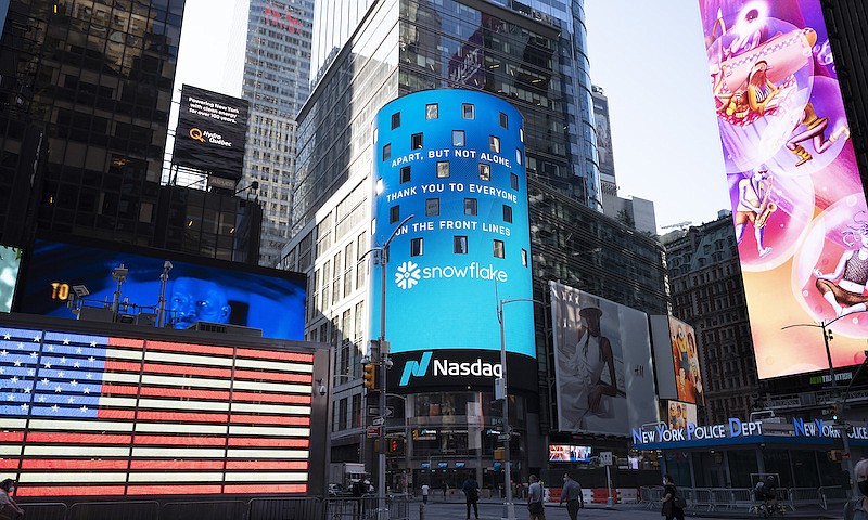 Cloud data warehouse company Snowflake is promoted at the Nasdaq MarketSite, Wednesday, Aug. 5, 2020, in New York's Times Square. (AP Photo/Mark Lennihan)