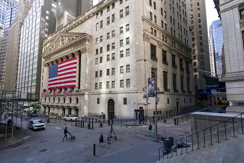 A giant American Flag hangs on the New York Stock Exchange, Monday, Sept. 21, 2020. U.S. stock indexes are mixed in early trading Wednesday, as Wall Street's tumultuous month continues to churn. (AP Photo/Mary Altaffer)