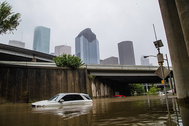Cars get stranded on high flood waters on Houston Ave. exit from Interstate 45 during Tropical Storm Beta Tuesday, Sept. 22, 2020, in Houston. (Marie D. De Jesus/Houston Chronicle via AP)