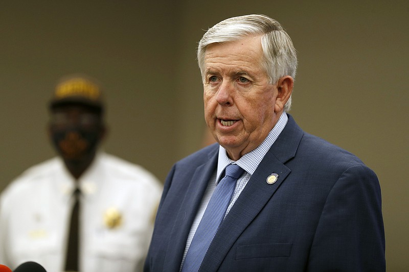 In this Aug. 6, 2020 file photo, Missouri Gov. Mike Parson speaks during a news conference in St. Louis. Gov. Parson, a Republican who has steadfastly refused to require residents to wear mask, and First Lady Teresa Parson tested positive for COVID-19, Wednesday, Sept. 23, 2020. (AP Photo/Jeff Roberson, File)