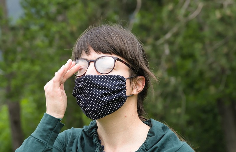 Portrait of Young Woman Wearing Protective Mask and Eyeglasses and Making Face because of Bad Air under Mask mask tile / Getty Images
