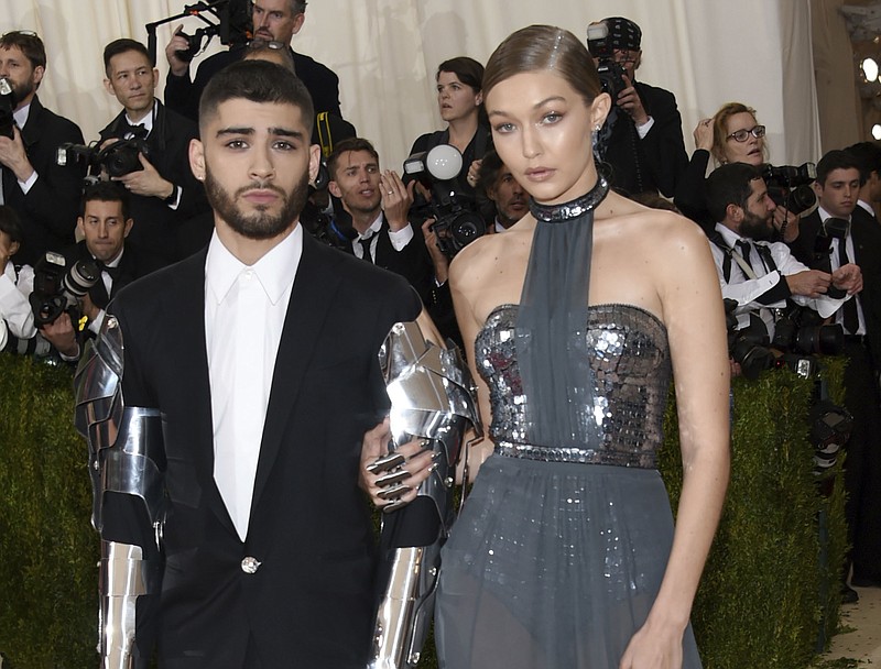 In this May 2, 2016 file photo, Zayn Malik, left, and Gigi Hadid arrive at The Metropolitan Museum of Art Costume Institute Benefit Gala in New York. The couple took to social media Wednesday, Sept. 23, 2020, to celebrate the arrival of their daughter. (Photo by Evan Agostini/Invision/AP, File)