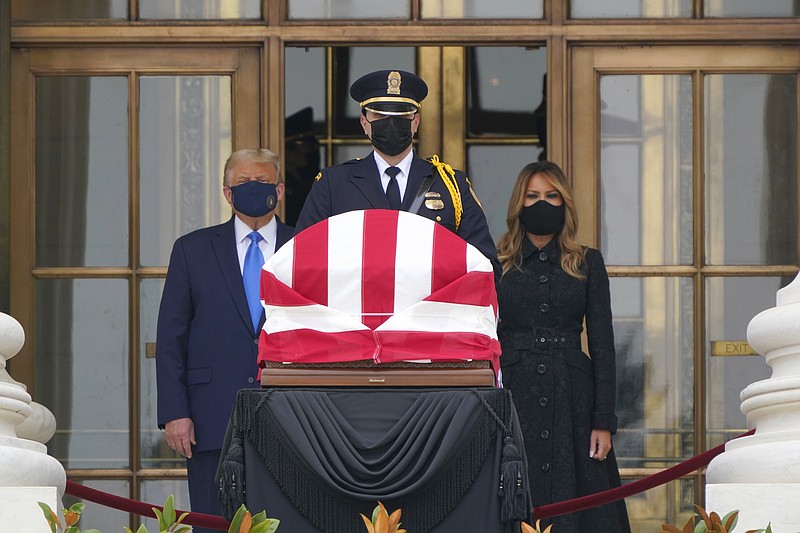President Donald Trump and first lady Melania Trump pay respects as Justice Ruth Bader Ginsburg lies in repose at the Supreme Court building on Thursday, Sept. 24, 2020, in Washington. Ginsburg, 87, died of cancer on Sept. 18. (AP Photo/J. Scott Applewhite)