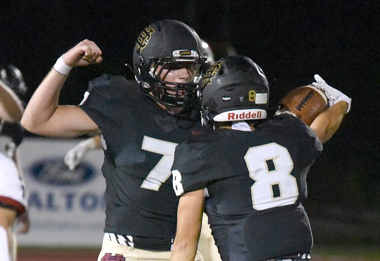 Staff photo by Matt Hamilton / Christian Heritage's Ben Hermann, left, and Tucker Jordan celebrate after Jordan intercepted a pass during a home win against Catoosa County's Heritage on Sept. 25.