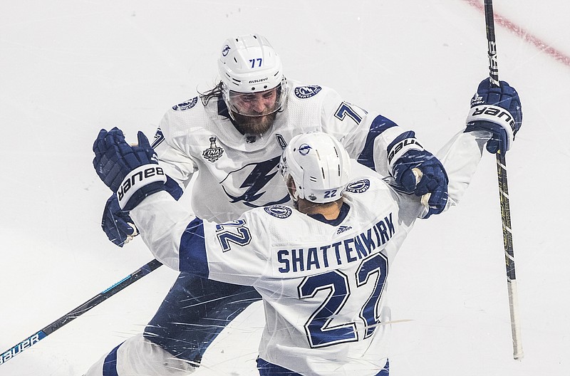 AP photo by Jason Franson / Tampa Bay Lightning defenseman Kevin Shattenkirk celebrates his power-play goal against the Dallas Stars with Victor Hedman during overtime of Game 4 of the Stanley Cup Final on Friday night in Edmonton.