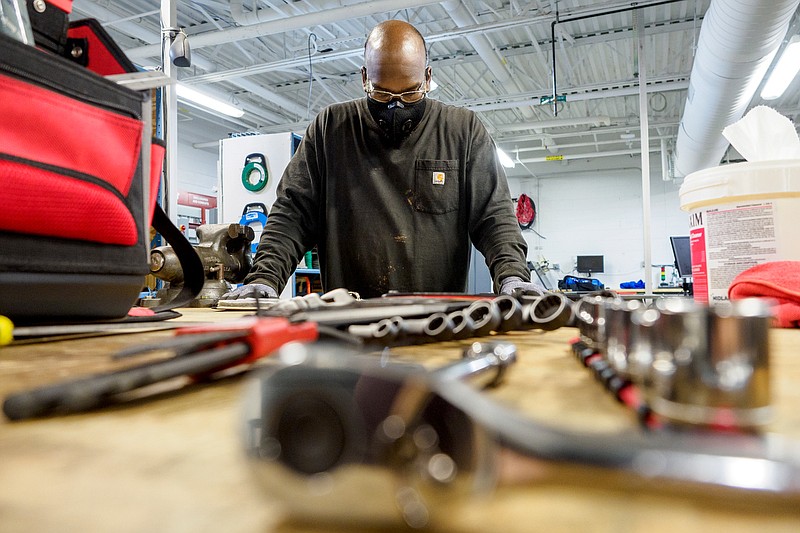 Staff photo by C.B. Schmelter / Willie Ballard looks over a notebook during an Industrial Maintenance Mechatronics class in the Center for Engineering, Arts & Sciences Building on the campus of Chattanooga State Community College on Friday, Sept. 25, 2020 in Chattanooga, Tenn.