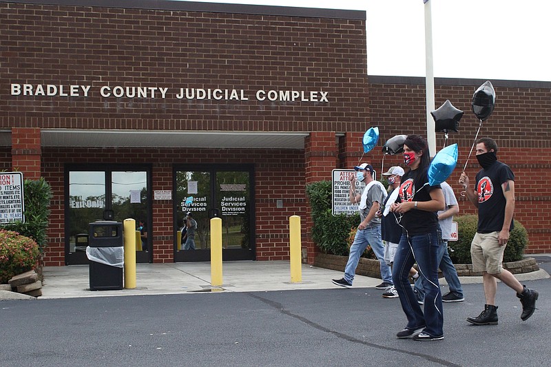 Staff photo by Wyatt Massey / Members of Bradley County Incarcerated Resolutions and family of Charlie Stevenson march outside the Bradley County Jail on Sept. 25, 2020. Stevenson died in police custody at the jail on Sept. 10.