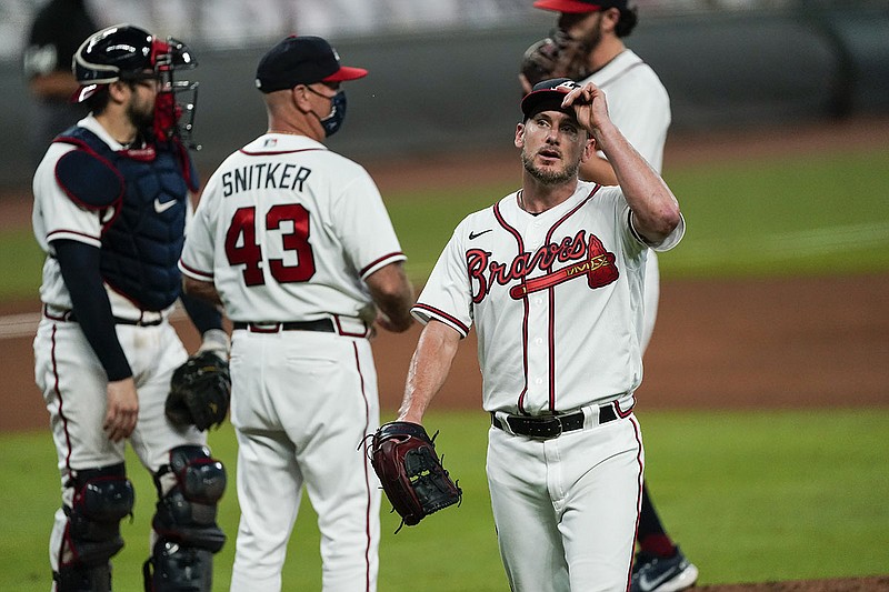 AP photo by John Bazemore / Atlanta Braves reliever Grant Dayton, right, walks off the mound after being pulled in the fifth inning of Saturday night's home game against the Boston Red Sox.