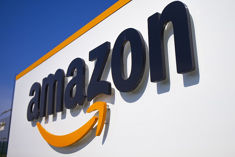 FILE - In this Thursday April 16, 2020 file photo, The Amazon logo is seen in Douai, northern France. Amazon is looking to kickstart holiday shopping early this year. The company said Monday, Sept. 28, 2020 that it will hold its annual Prime Day sales event over two days in October That's because the pandemic forced it to be postponed from July. It's the first time the sales event is being held in the fall. (AP Photo/Michel Spingler, File)