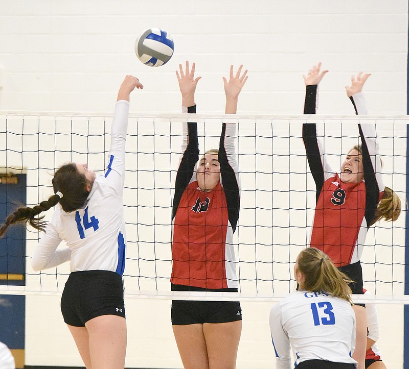 Staff Photo by Matt Hamilton / GPS (14) Caroline Long fires the ball over the net as Signal Mountain (18) Harmony McCarter and (9) Ellie Werner defend. The Girls Preparatory School Bruisers defeated the Signal Mountain High School Lady Eagles, 3-0, on Monday, Sept. 28, 2020. 