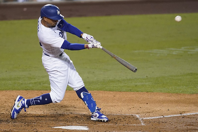 Los Angeles Dodgers' Mookie Betts flies out to right field during the third inning of the team's baseball game against the Los Angeles Angels on Friday, Sept. 25, 2020, in Los Angeles. (AP Photo/Ashley Landis)