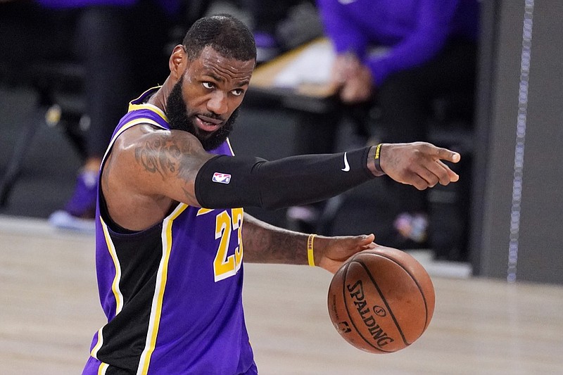 Los Angeles Lakers' LeBron James sets up a play during the second half of an NBA conference final playoff basketball game against the Denver Nuggets Saturday, Sept. 26, 2020, in Lake Buena Vista, Fla. (AP Photo/Mark J. Terrill)