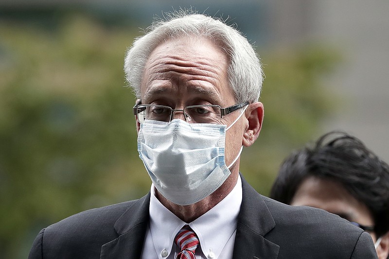 FILE - In this Sept. 15, 2020, file photo, former Nissan Motor Co. executive Greg Kelly arrives for the first trial hearing at the Tokyo District Court in Tokyo. A Nissan employee testified Tuesday, Sept. 29, 2020 that he worked with another former Nissan executive, American Greg Kelly to find ways to pay the automaker's former chairman, Carlos Ghosn without fully disclosing his compensation. (Kiyoshi Ota/Pool Photo via AP, File)