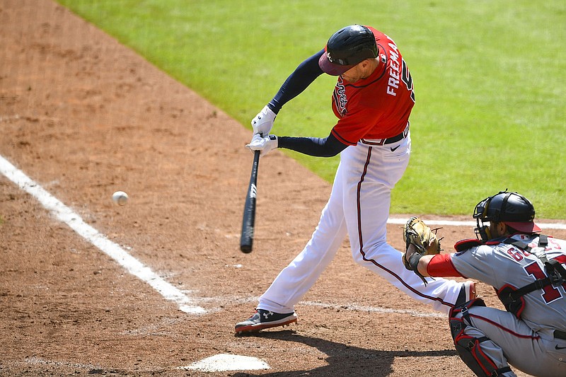 AP photo by John Amis / Atlanta's Freddie Freeman connects for a grand slam during a home game against the Washington Nationals on Sept. 6. Freeman and the Braves have won three straight NL East Division championships, but the franchise's drought without winning a postseason series is almost two full decades old.