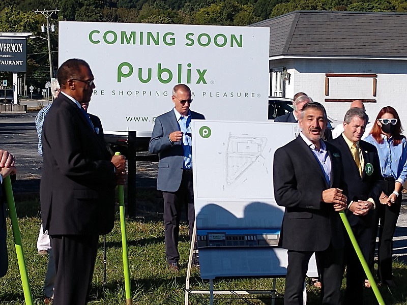 Staff photo by Mike Pare / Ground was broken for a new Publix supermarket in Chattanooga's South Broad district on Wednesday. Nick Churillo, Publix district manager, at right with shovel, talks about the store. At left, with shovel, is City Councilman Erskine Oglesby.