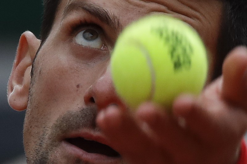 AP photo by Alessandra Tarantino / Novak Djokovic serves against Ricardas Berankis during a second-round match Thursday at the French Open. Although Djokovic has been his usual dominant self at the clay court major, lesser known players have made some noise as well.