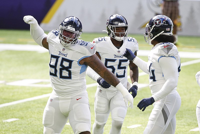 AP photo by Bruce Kluckhohn / Tennessee Titans defensive tackle Jeffery Simmons (98) celebrates with teammates after a sack during the first half of the team's win last Sunday against the Minnesota Vikings in Minneapolis.