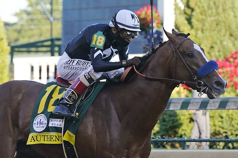 AP photo by Darron Cummings / Authentic, ridden by jockey John Velazquez, heads to the finish line to win the Kentucky Derby on Sept. 5 at Churchill Downs in Louisville.