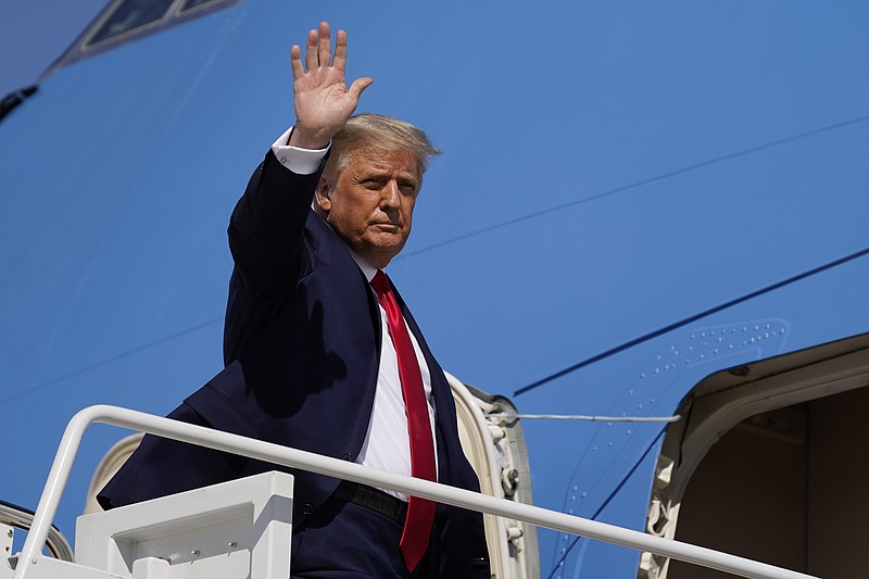 The Associated Press / President Donald Trump waves while boarding Air Force One as he departs Andrews Air Force Base recently.