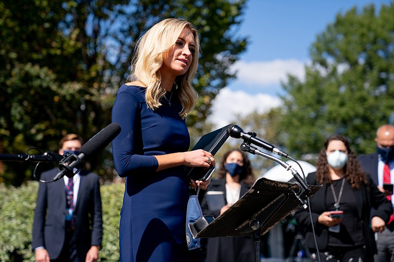 Anna Moneymaker, The New York Times / White House Press Secretary Kayleigh McEnany speaks to reporters at the White House in Washington, on Friday. Staff members now have openly donned masks to protect against the spread of COVID-19 after the president and first lady have tested positive.