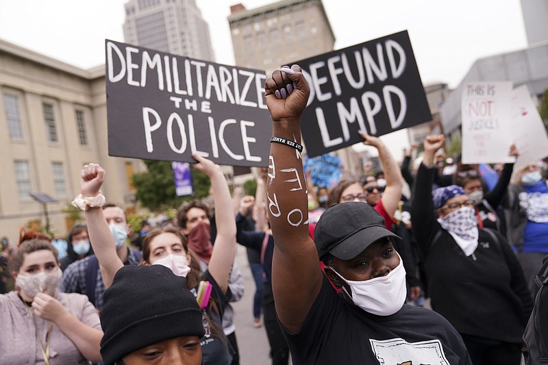  In this Sept. 23, 2020, file photo, protesters speak in Louisville, Ky. Hours of material in the grand jury proceedings for Taylor's fatal shooting by police have been made public on Friday, Oct. 2. (AP Photo/John Minchillo, File)