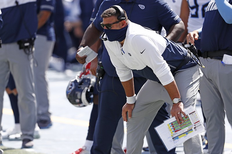 AP file photo by Wade Payne / Tennessee Titans coach Mike Vrabel's third season in Nashville has started 3-0, but the chance to add a fourth win is on hold as the team deals with a COVID-19 outbreak that has already postponed one game until later this month.