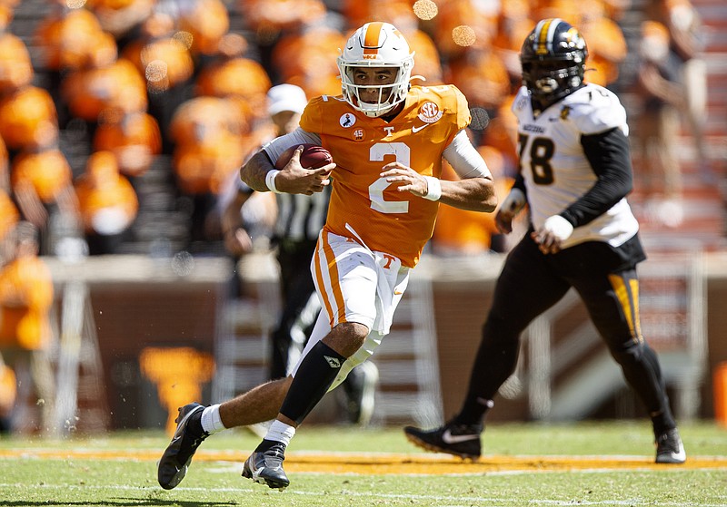 Tennessee Athletics photo by Caleb Jones / Tennessee fifth-year senior quarterback Jarrett Guarantano looks for running room during Saturday's 35-12 dismantling of Missouri inside Neyland Stadium.