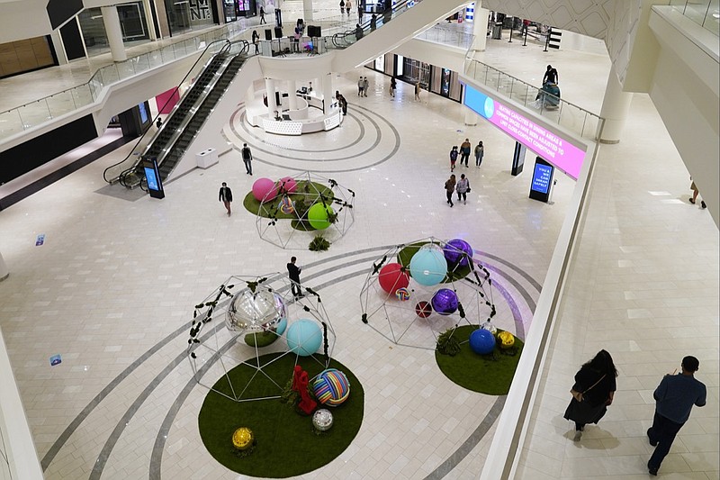 Shoppers wend their way through multiple levels of retail stores and amusement attractions at the American Dream Mall, Thursday, Oct. 1, 2020, in East Rutherford, New Jersey. The megamall reopened Thursday for the first time since mid-March when it was forced to close due to concerns over the spread of the coronavirus. (AP Photo/Kathy Willens)