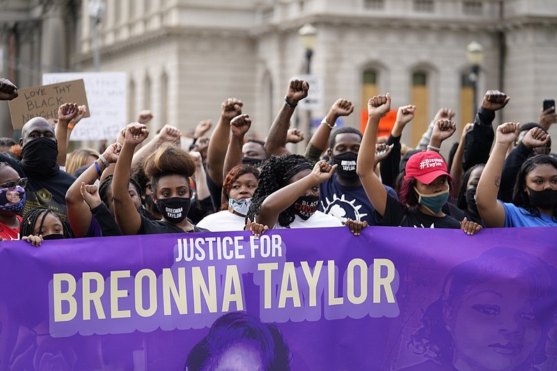 FILE - In this Sept. 25, 2020, file photo, Black Lives Matter protesters march in Louisville. Hours of material in the grand jury proceedings for Taylor's fatal shooting by police have been made public on Friday, Oct. 2. (AP Photo/Darron Cummings, File)