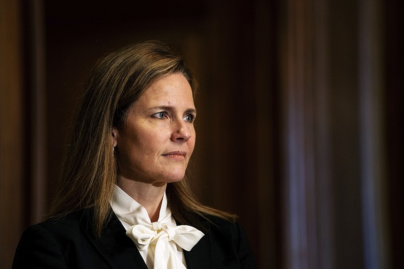 Judge Amy Coney Barrett, President Donald Trumps nominee for the U.S. Supreme Court, meets with Sen. Josh Hawley, R-Mo., on Capitol Hill in Washington, Thursday, Oct. 1, 2020. Barrett graduated with honors in 1994 from a small liberal arts school, Rhodes College in Memphis. Many alumni have posted a letter on social media expressing their opposition to Barrett's nomination to replace Justice Ruth Bader Ginsburg on the U.S. Supreme Court after Ginsburg's death last month.(Demetrius Freeman/The Washington Post via AP, Pool)

