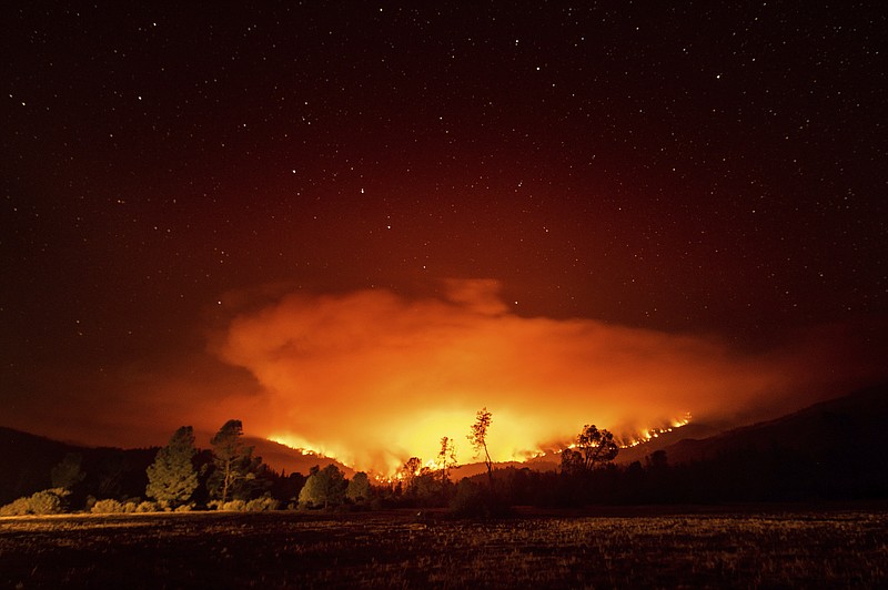 In this Sept. 16, 2020 file photo the August Complex Fire burns near Lake Pillsbury in the Mendocino National Forest, Calif. The staggering scale of California's wildfires has reached another milestone. The new mark for the August Complex Fire in the Coast Range between San Francisco and the Oregon state line on Monday, Oct. 5, 2020, surpassed 1 million acres. (AP Photo/Noah Berger, File)