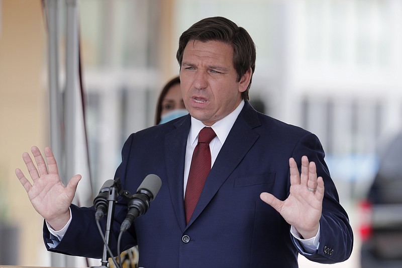 In this May 14, 2020, file photo, Florida Gov. Ron DeSantis speaks at a news conference in Doral, Fla. DeSantis is extending the state's voter registration deadline that expired Monday, Oct. 5 until 7 p.m. EDT Tuesday, Oct. 6 after heavy traffic crashed the state's online system and potentially prevented thousands of enrolling to cast ballots in next month's presidential election. (AP Photo/Lynne Sladky, File)