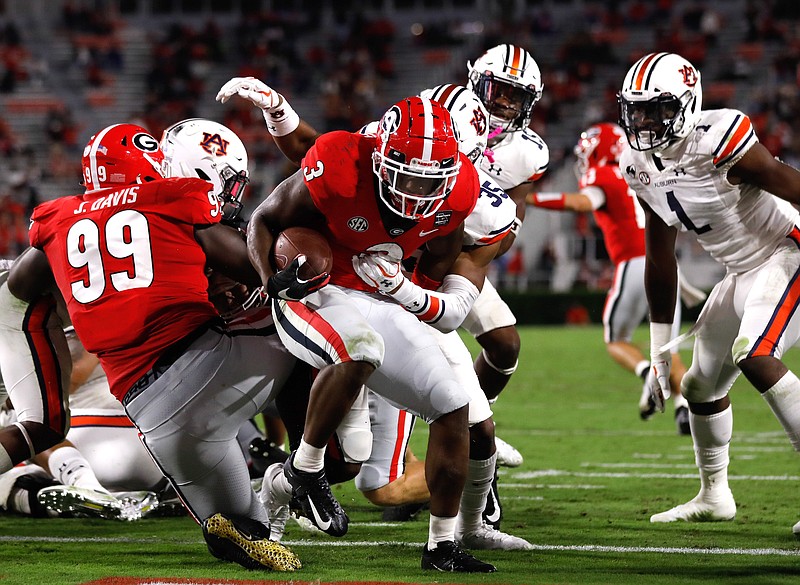 Georgia photo by Andrew Davis Tucker / Georgia running back Zamir White rushed for 88 yards and a pair of touchdowns last Saturday night as the Bulldogs drubbed Auburn 27-6.