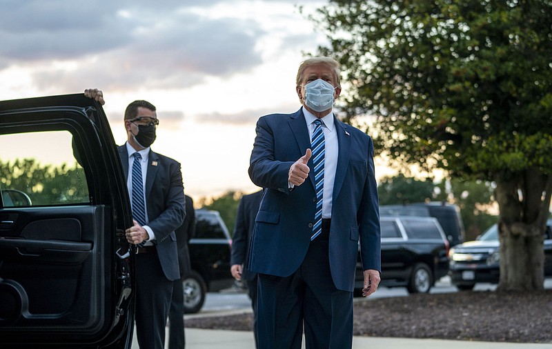 Photo by Doug Mills of The New York Times / President Donald Trump gestures a thumbs up as he departs the Walter Reed Medical Center in Bethesda, Maryland, after testing positive for COVID-19 and spending four days at the facility, on Oct. 5, 2020.