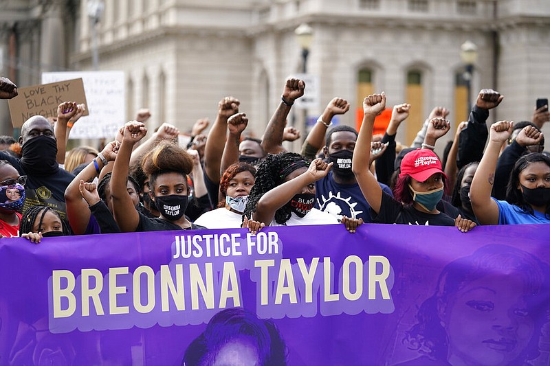In this Sept. 25, 2020, file photo, Black Lives Matter protesters march in Louisville. Hours of material in the grand jury proceedings for Taylor's fatal shooting by police have been made public on Friday, Oct. 2. (AP Photo/Darron Cummings, File)