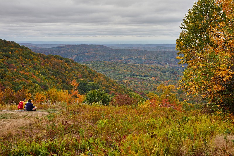 Hikers in the Berkshires in Massachusetts, in September 2020. From the Berkshires to the Rockies, the vibrant colors of fall are popping, and nothing, not even a pandemic, can stop them. (Tara Donne/The New York Times)